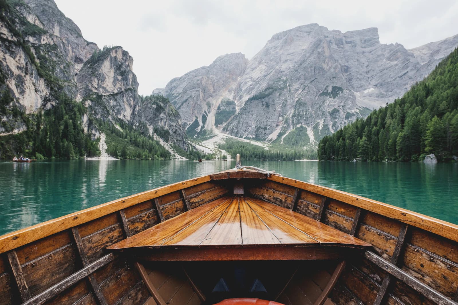 An alpine lake reflecting mountains and a quiet lakeside village